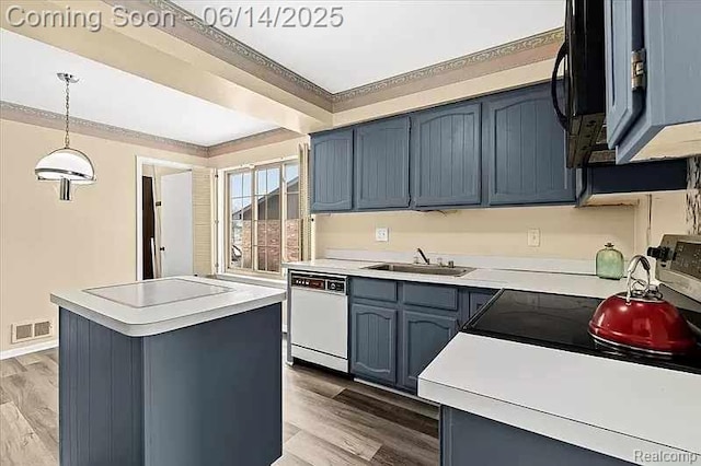 29146 W Wellington Unit 83, Southfield, MI 48034 - kitchen with dishwasher, electric stovetop, wood finished floors, blue cabinets, and light countertops