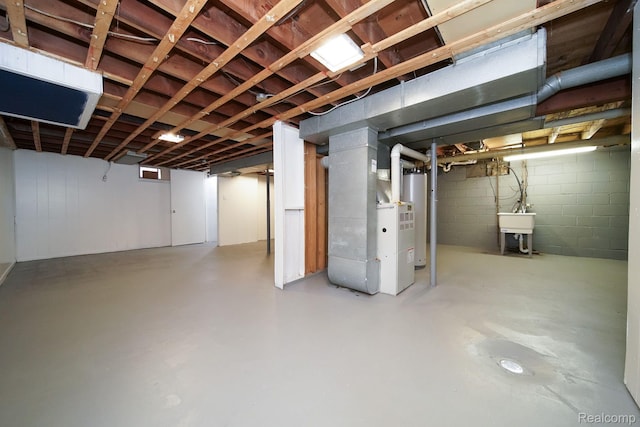 967 Keith St, Oxford, MI 48371 - unfinished basement featuring gas water heater, a sink, concrete block wall, and heating unit
