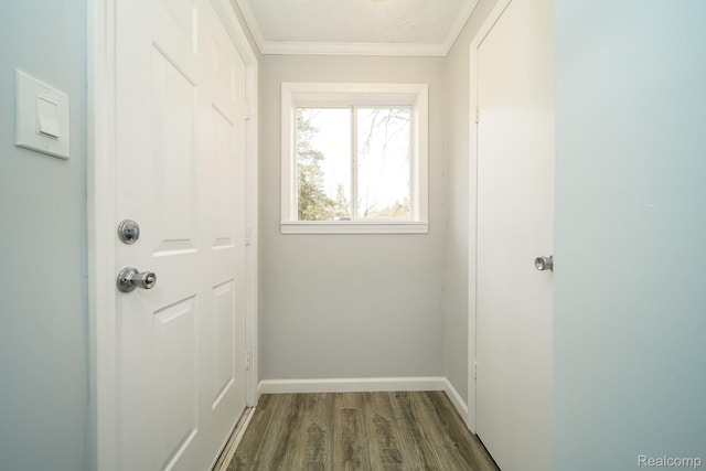 967 Keith St, Oxford, MI 48371 - doorway with wood finished floors, baseboards, crown molding, and a textured ceiling