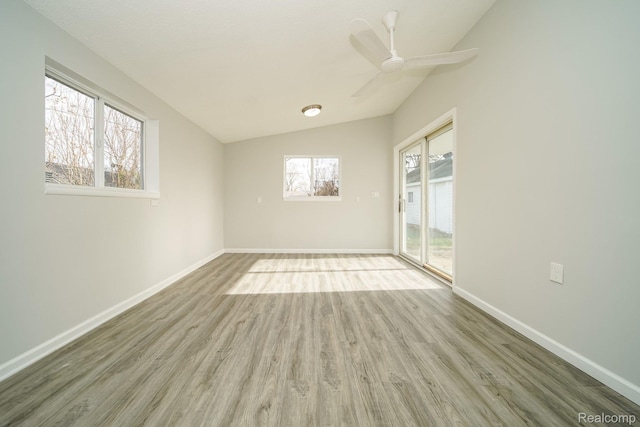967 Keith St, Oxford, MI 48371 - empty room with lofted ceiling, wood finished floors, baseboards, and ceiling fan