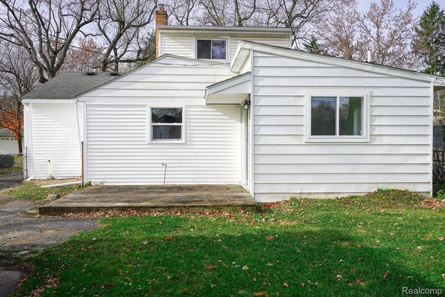 967 Keith St, Oxford, MI 48371 - back of property featuring a chimney