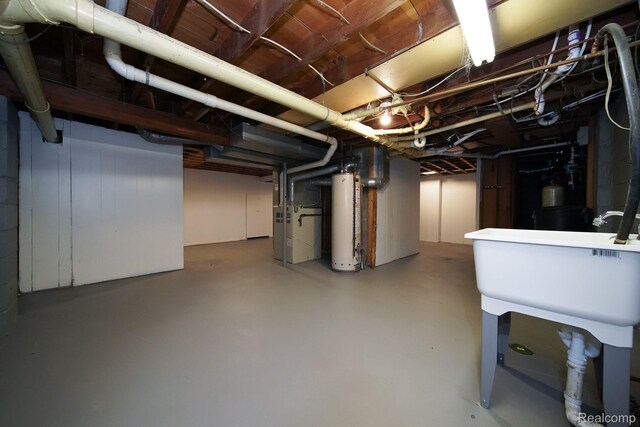 967 Keith St, Oxford, MI 48371 - unfinished basement featuring gas water heater and heating unit