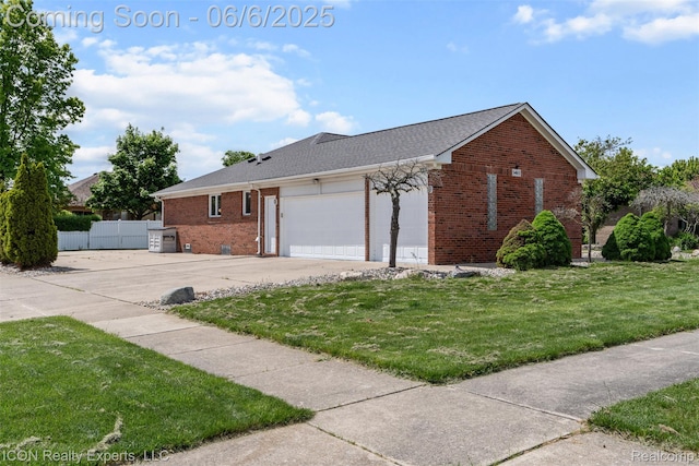 54613 Laurel Dr, Macomb, MI 48042 - view of front facade with brick siding, driveway, and a garage