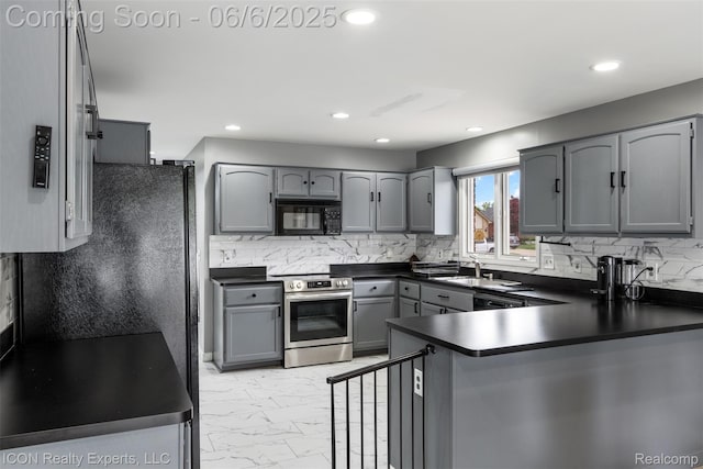 54613 Laurel Dr, Macomb, MI 48042 - kitchen featuring black microwave, electric stove, dark countertops, gray cabinets, and a peninsula