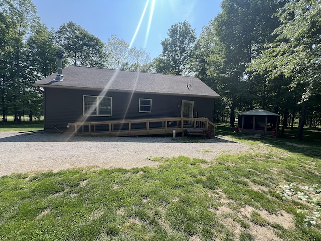 252 E Fenn Rd, Coldwater, MI 49036 - rear view of property with a wooden deck, a yard, a gazebo, and a shingled roof
