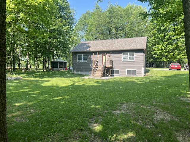 252 E Fenn Rd, Coldwater, MI 49036 - back of property featuring a yard