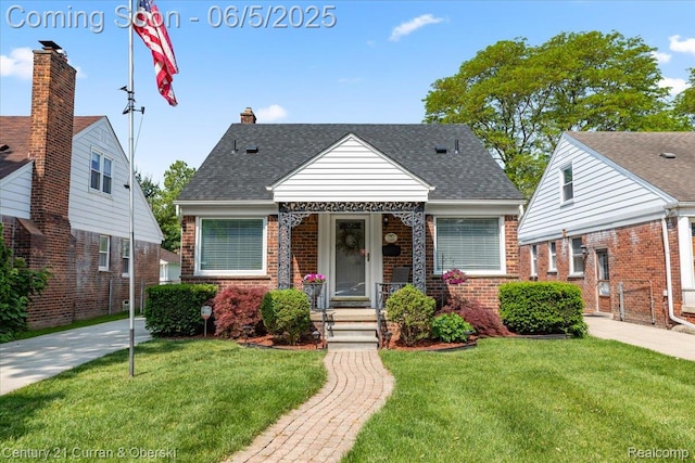 1731 N Franklin St, Dearborn, MI 48128 - bungalow-style house with a front lawn, brick siding, and roof with shingles