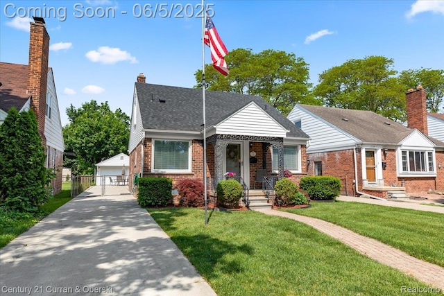 1731 N Franklin St, Dearborn, MI 48128 - view of front of house featuring brick siding, an outdoor structure, a detached garage, and a gate