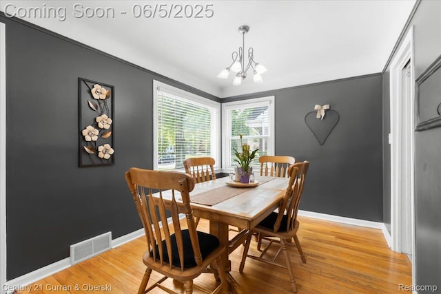 1731 N Franklin St, Dearborn, MI 48128 - dining space featuring a chandelier, light wood finished floors, baseboards, and crown molding