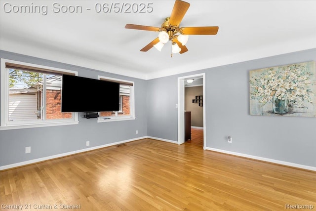 1731 N Franklin St, Dearborn, MI 48128 - unfurnished living room with ceiling fan, plenty of natural light, light wood-style floors, and baseboards