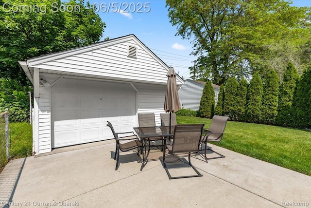 1731 N Franklin St, Dearborn, MI 48128 - view of patio / terrace with an outdoor structure, a garage, and outdoor dining space