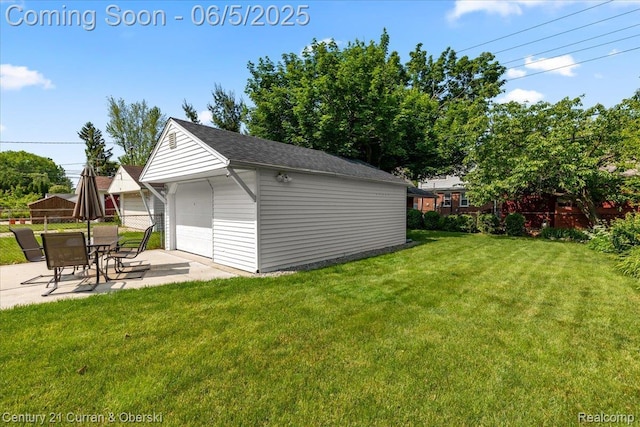1731 N Franklin St, Dearborn, MI 48128 - view of yard featuring a garage, an outdoor structure, and a patio