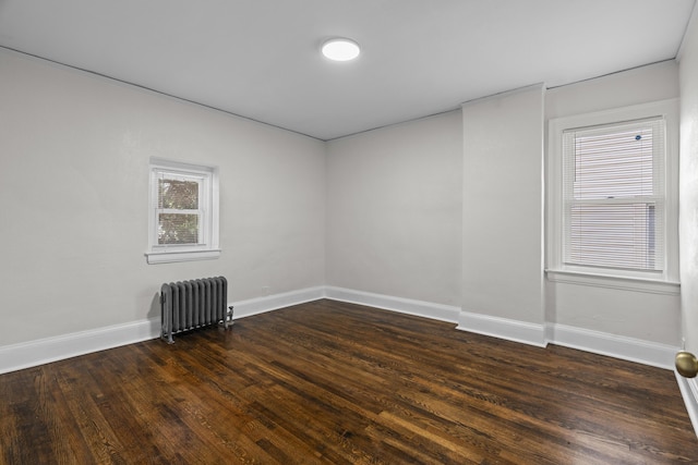 16631 Lawton St, Detroit, MI 48221 - spare room with radiator, baseboards, and dark wood finished floors