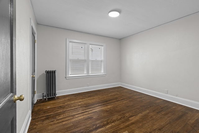 16631 Lawton St, Detroit, MI 48221 - spare room featuring radiator heating unit, wood finished floors, and baseboards