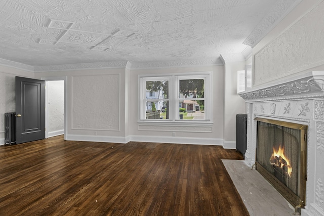16631 Lawton St, Detroit, MI 48221 - unfurnished living room with a fireplace with flush hearth, hardwood / wood-style flooring, baseboards, radiator, and ornamental molding