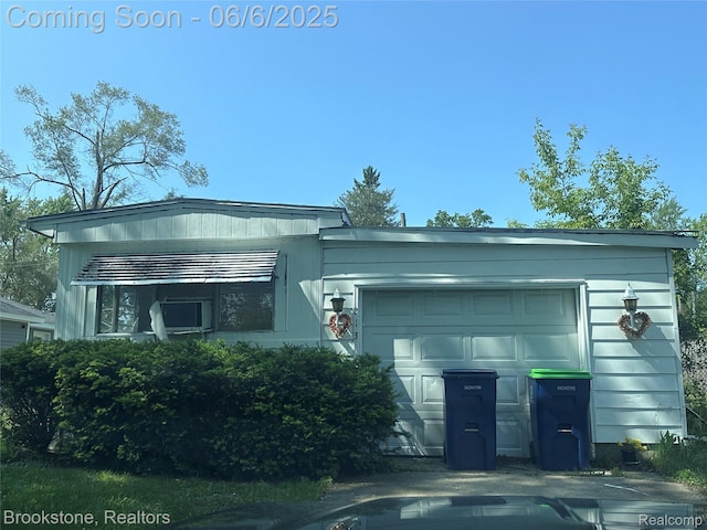 213 E Oak St, Saint Charles, MI 48655 - view of front of property with an attached garage