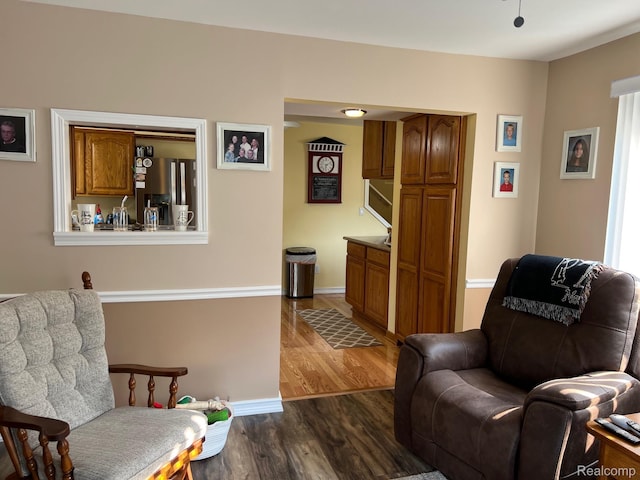 3742 W Barnes Lake Rd, Columbiaville, MI 48421 - sitting room featuring dark wood finished floors and baseboards