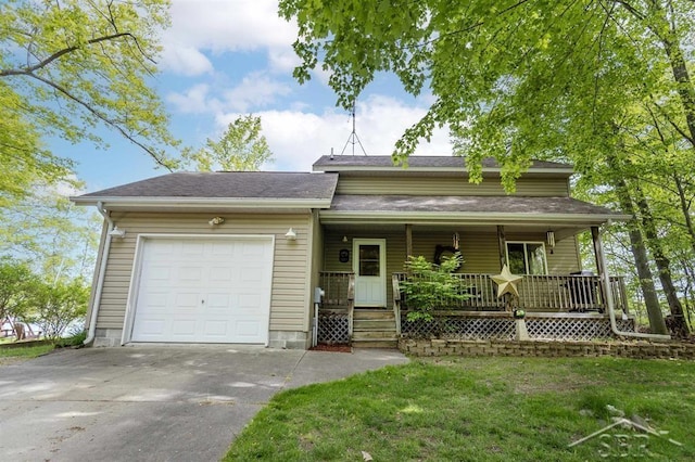 3485 Lakeshore Dr, Lupton, MI 48635 - view of front of house with an attached garage, driveway, covered porch, and a front lawn