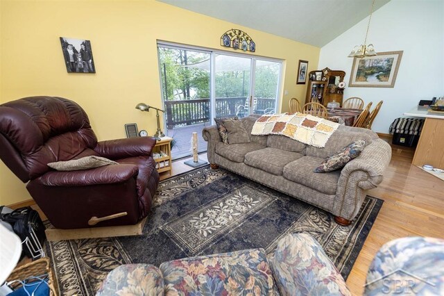 3485 Lakeshore Dr, Lupton, MI 48635 - living area with wood finished floors and vaulted ceiling