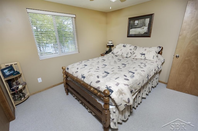 3485 Lakeshore Dr, Lupton, MI 48635 - bedroom with carpet, baseboards, and a ceiling fan