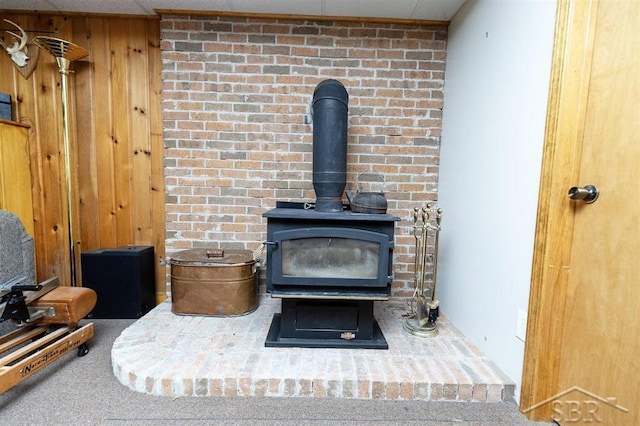 3485 Lakeshore Dr, Lupton, MI 48635 - detailed view of a wood stove and wood walls