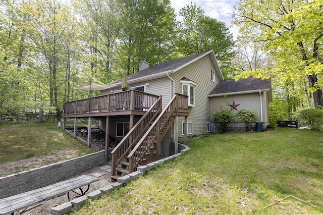 3485 Lakeshore Dr, Lupton, MI 48635 - back of house with a wooden deck, stairway, a yard, a chimney, and a shingled roof