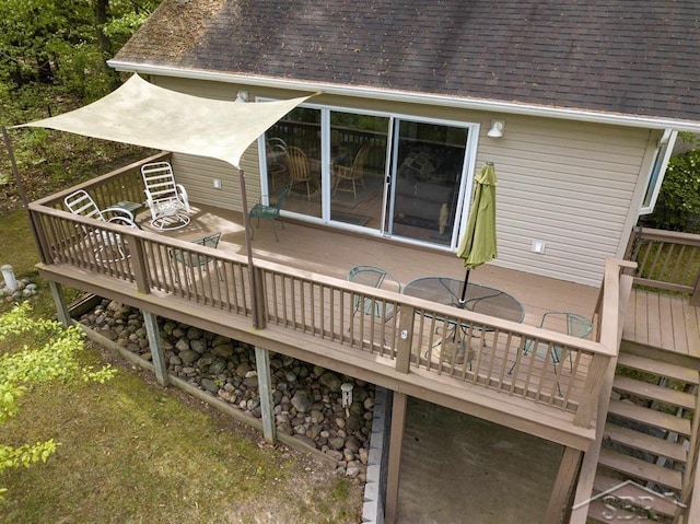3485 Lakeshore Dr, Lupton, MI 48635 - wooden deck with outdoor dining space