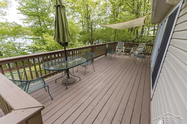 3485 Lakeshore Dr, Lupton, MI 48635 - wooden terrace featuring outdoor dining area
