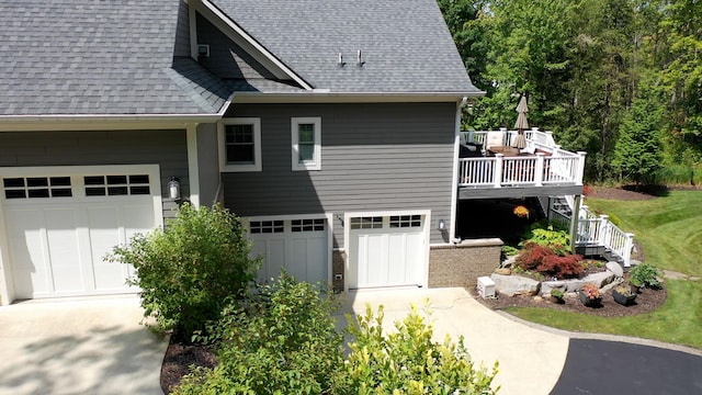 8680 Dexter Pinckney Rd, Pinckney, MI 48169 - view of property exterior with roof with shingles, driveway, stairway, a wooden deck, and a garage