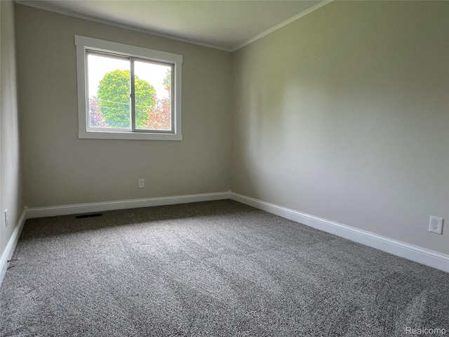 5327 E Carpenter Rd, Grand Blanc, MI 48506 - carpeted spare room with baseboards and crown molding