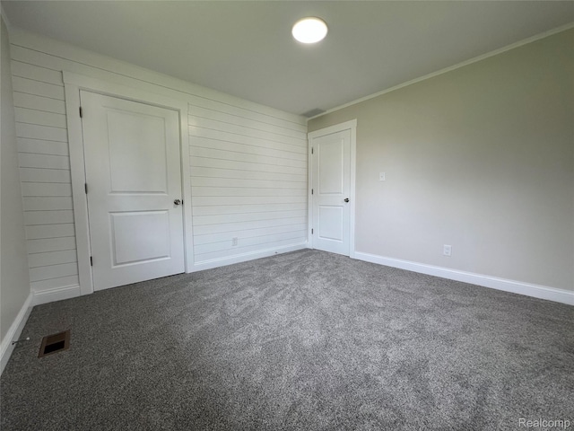 5327 E Carpenter Rd, Grand Blanc, MI 48506 - carpeted empty room featuring baseboards and ornamental molding