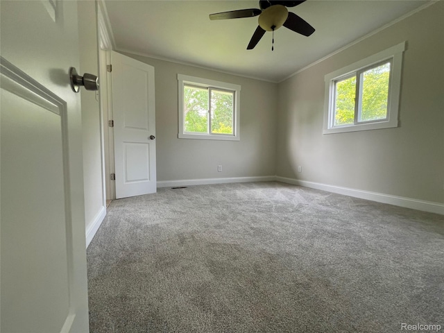 5327 E Carpenter Rd, Grand Blanc, MI 48506 - carpeted spare room featuring crown molding, plenty of natural light, and ceiling fan