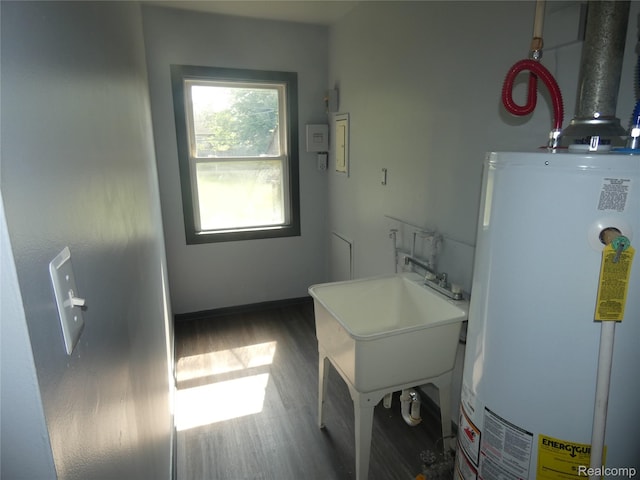 21054 Ehlert Ave, Utica, MI 48089 - laundry area featuring water heater and wood finished floors