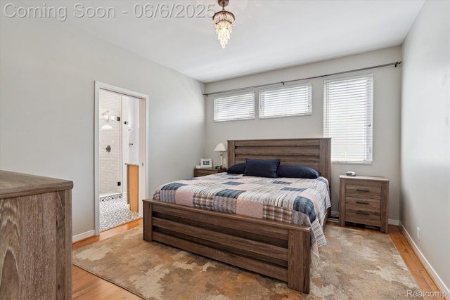 4118 Shoreview Ln, Whitmore Lake, MI 48189 - bedroom featuring wood finished floors, connected bathroom, and baseboards