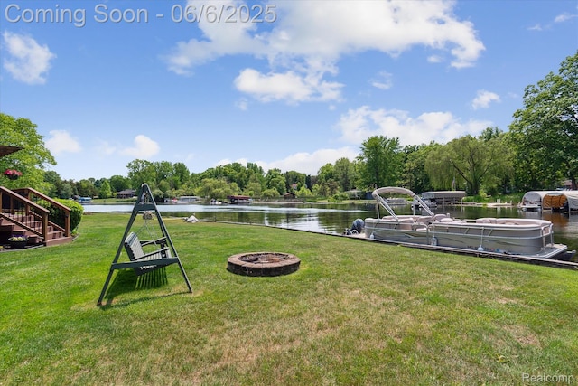 4118 Shoreview Ln, Whitmore Lake, MI 48189 - view of grassy yard with a water view, an outdoor fire pit, and stairs