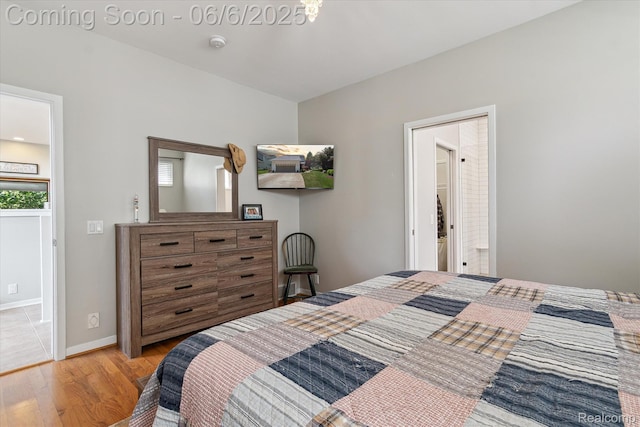 4118 Shoreview Ln, Whitmore Lake, MI 48189 - bedroom with light wood-style floors and baseboards