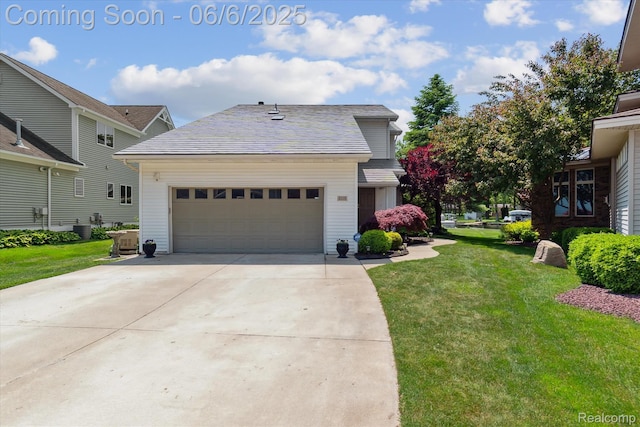4118 Shoreview Ln, Whitmore Lake, MI 48189 - view of front facade featuring a front lawn, driveway, a garage, and central AC