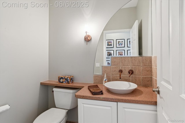 4118 Shoreview Ln, Whitmore Lake, MI 48189 - bathroom with toilet, backsplash, and vanity