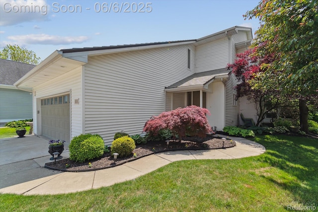 4118 Shoreview Ln, Whitmore Lake, MI 48189 - view of property exterior featuring an attached garage, a lawn, and driveway