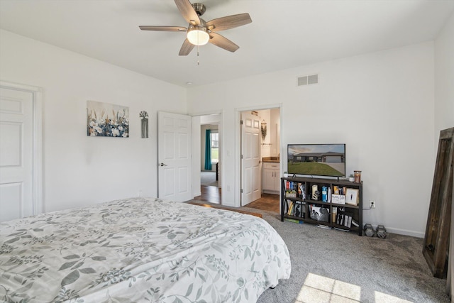 10 Windswept Ln, Hillsdale, MI 49242 - bedroom with carpet, ceiling fan, connected bathroom, and baseboards
