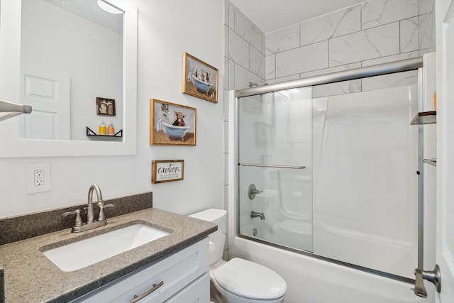 10 Windswept Ln, Hillsdale, MI 49242 - bathroom featuring toilet, vanity, and bath / shower combo with glass door