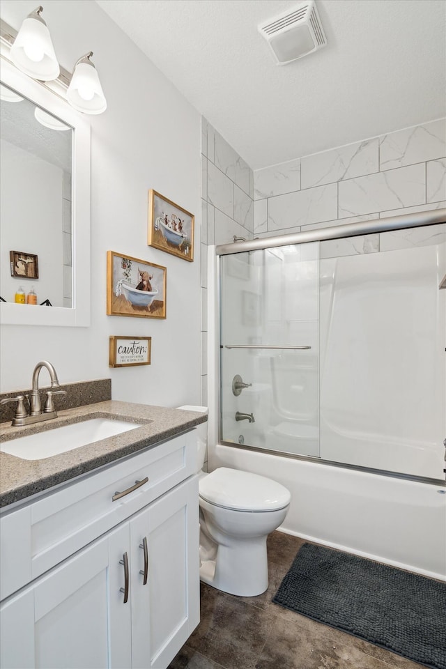 10 Windswept Ln, Hillsdale, MI 49242 - full bath featuring vanity, toilet, and shower / bath combination with glass door