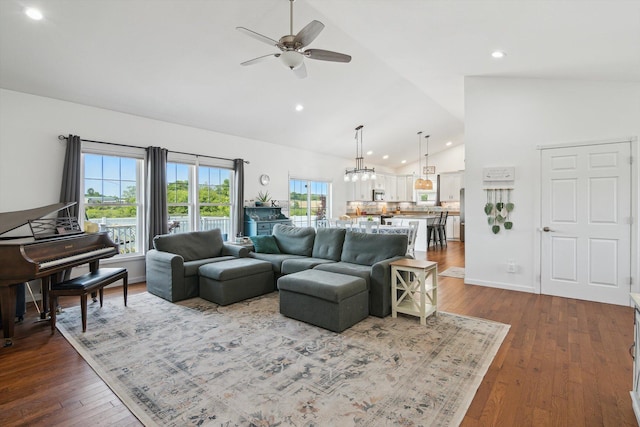 10 Windswept Ln, Hillsdale, MI 49242 - living area featuring a ceiling fan, dark wood-style floors, high vaulted ceiling, recessed lighting, and a chandelier