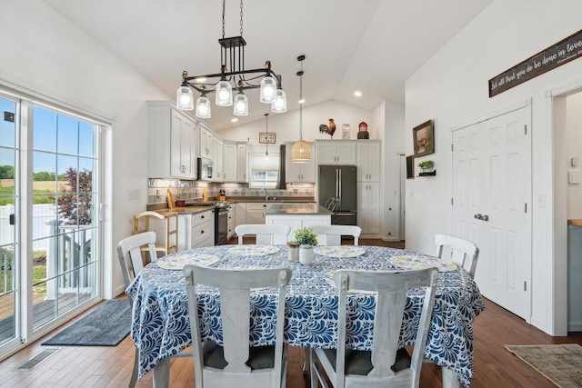 10 Windswept Ln, Hillsdale, MI 49242 - dining room with lofted ceiling, dark wood finished floors, and recessed lighting