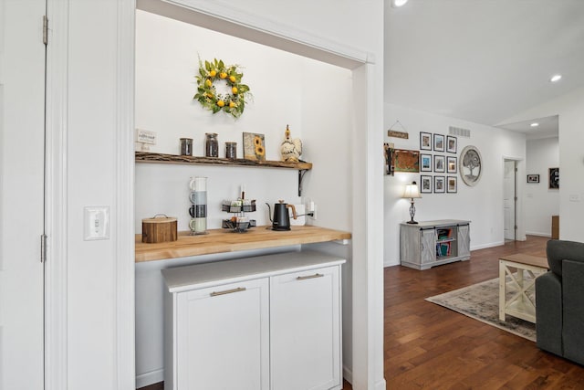 10 Windswept Ln, Hillsdale, MI 49242 - bar featuring dark wood finished floors, recessed lighting, vaulted ceiling, and baseboards