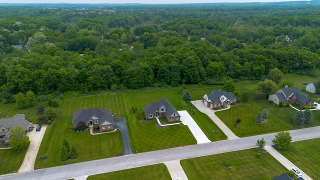 133 E Auburn Trl, Brighton, MI 48114 - aerial view of residential area featuring a heavily wooded area