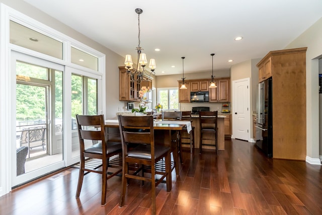 133 E Auburn Trl, Brighton, MI 48114 - dining room with dark wood-style flooring, recessed lighting, and a chandelier