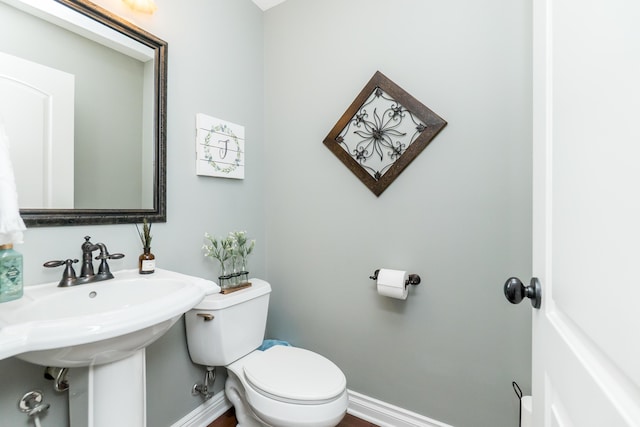 133 E Auburn Trl, Brighton, MI 48114 - bathroom with toilet and baseboards