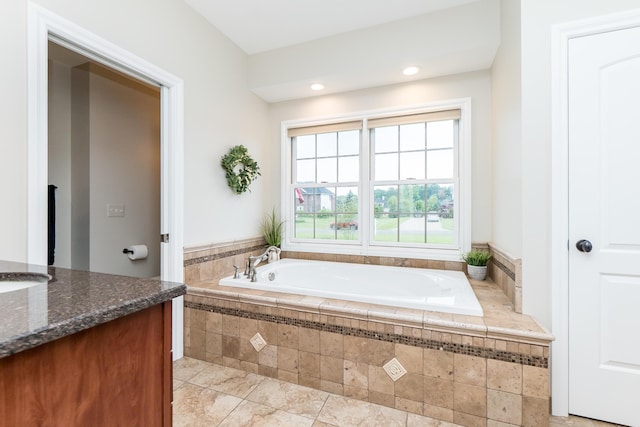 133 E Auburn Trl, Brighton, MI 48114 - bathroom featuring vanity, a garden tub, and recessed lighting