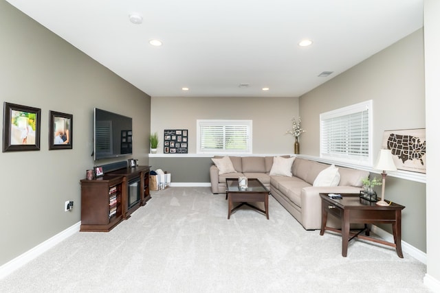 133 E Auburn Trl, Brighton, MI 48114 - living room featuring light carpet, recessed lighting, and baseboards